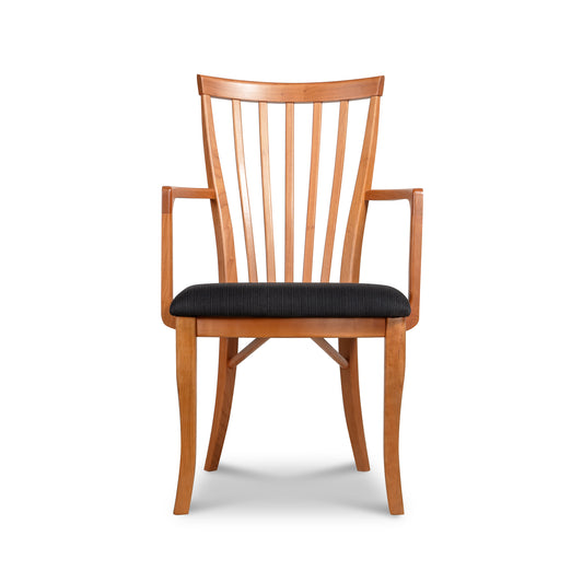 Lyndon Furniture Classic Shaker Arm Chair with curved arms, slatted back, and black seat cushion.