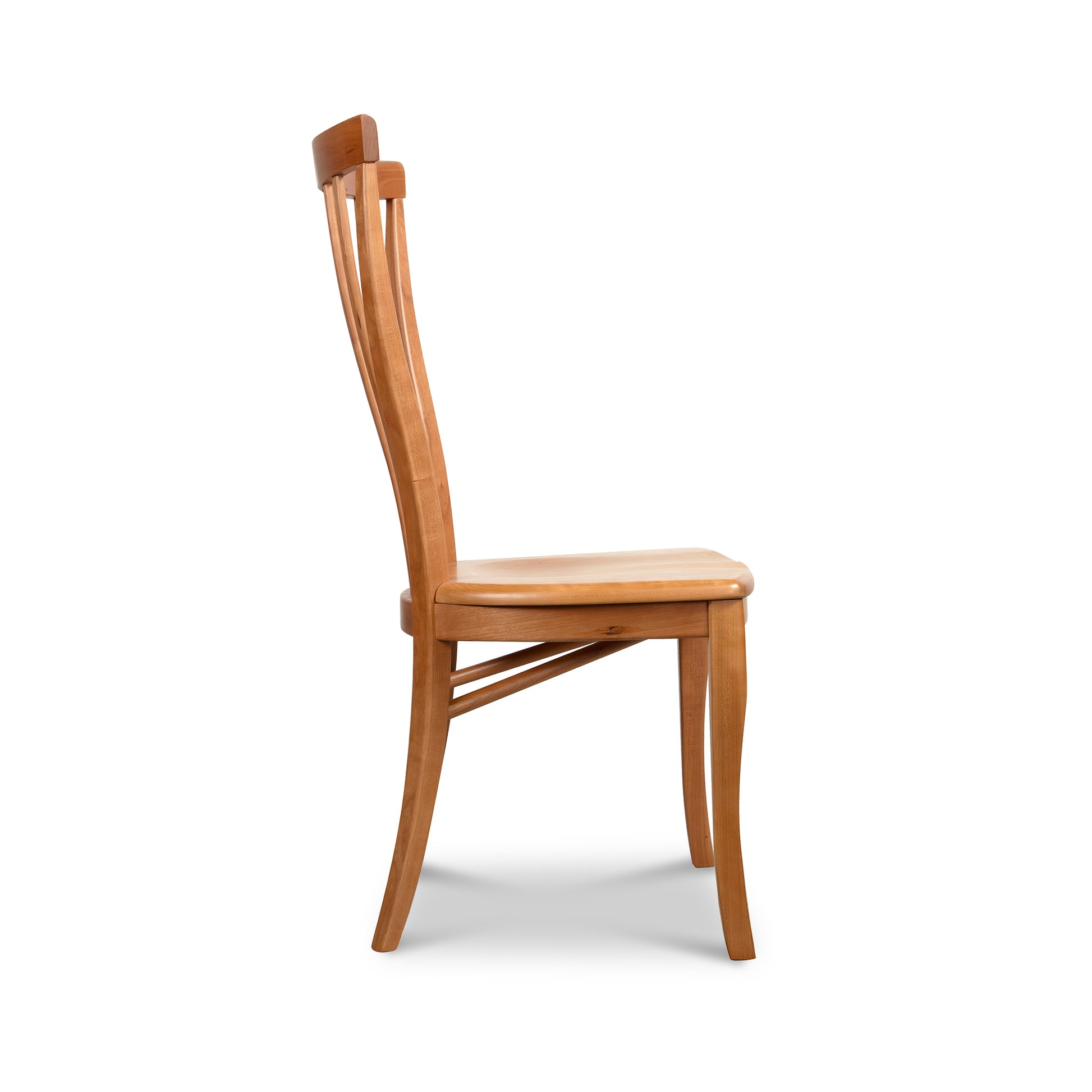 Lyndon Furniture Classic Shaker Chair #1 featuring a scooped wooden seat, shown from the side to highlight its craftsmanship and design.