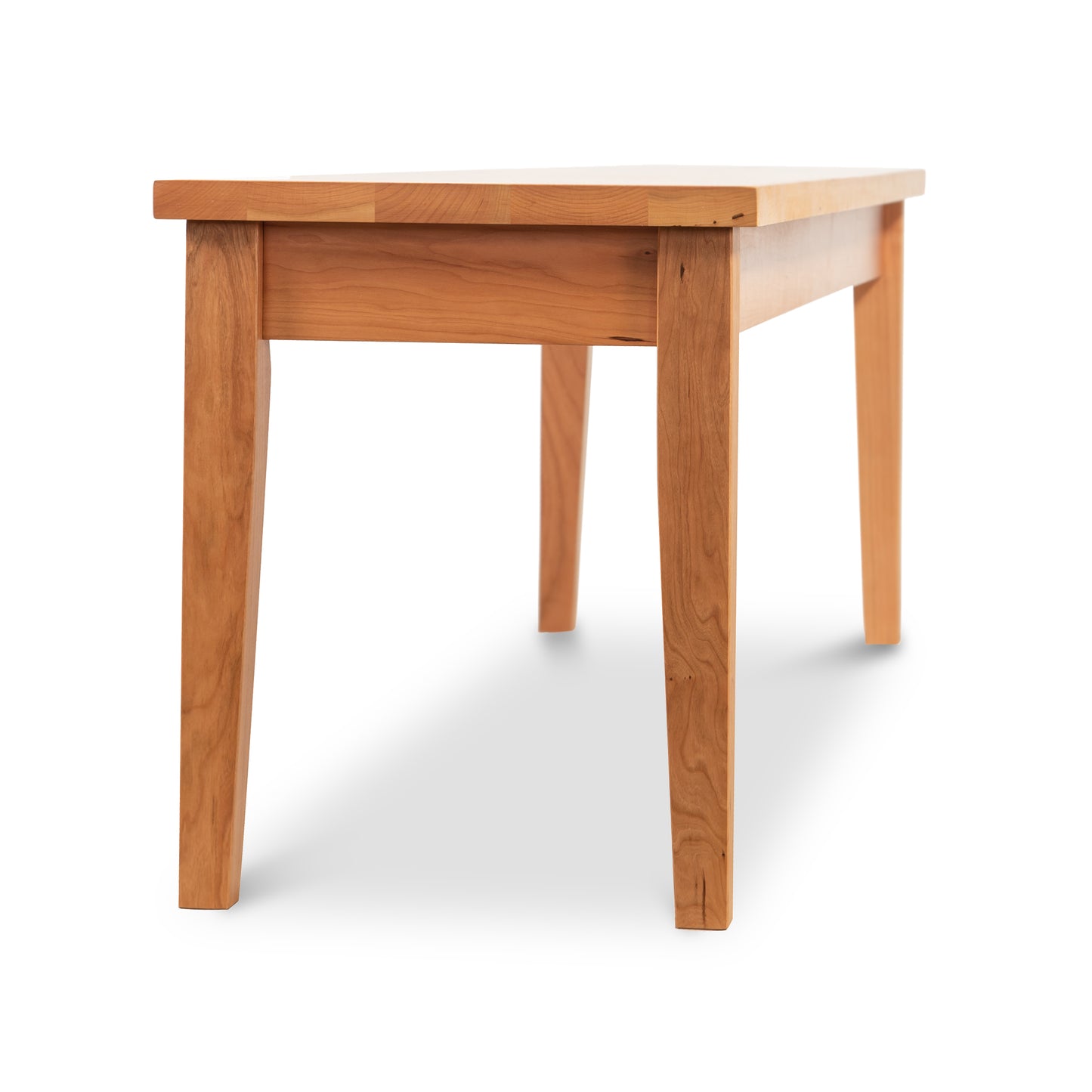 Lyndon Furniture Classic Shaker Bench with solid wood seat and four legs, handcrafted in classic Shaker style.