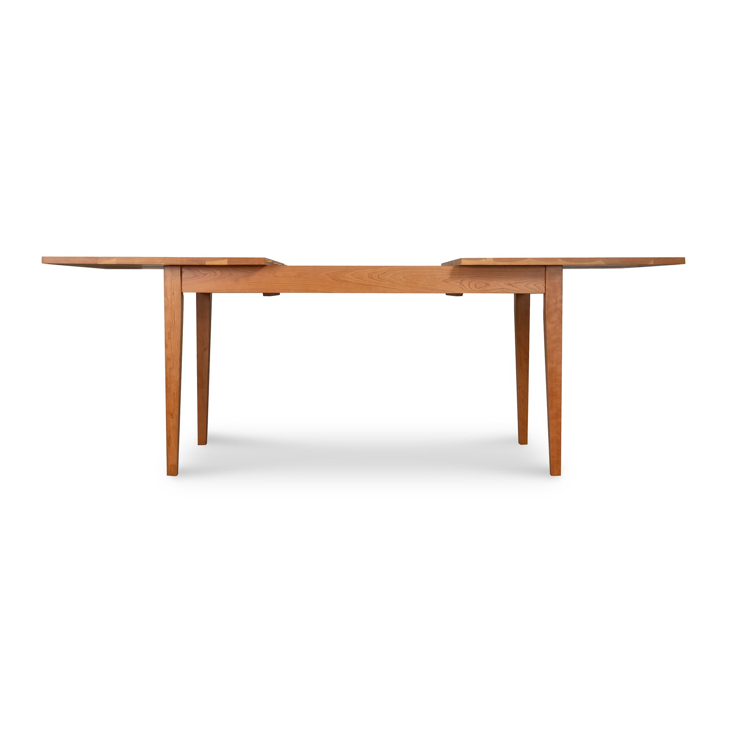 Lyndon Furniture Classic Shaker Butterfly Extension Table made of solid wood, showcasing its elegant craftsmanship and timeless design.
