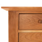 A close up of a Lyndon Furniture Classic Shaker Flare Leg 48" Hunt Board chest of drawers.