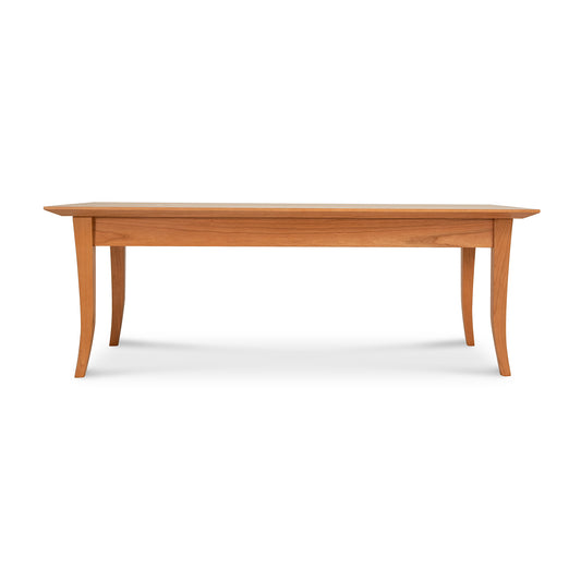 Classic Shaker Flare Leg Coffee Table by Lyndon Furniture with elegantly curved legs and a smooth rectangular top, showcasing fine American craftsmanship.