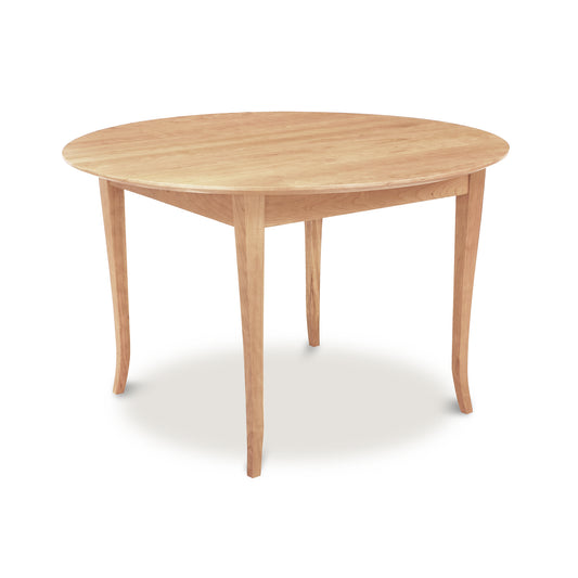 Lyndon Furniture Classic Shaker Flare Leg Round Solid Top Table crafted from solid hardwoods, showcasing elegant curves and expert craftsmanship.