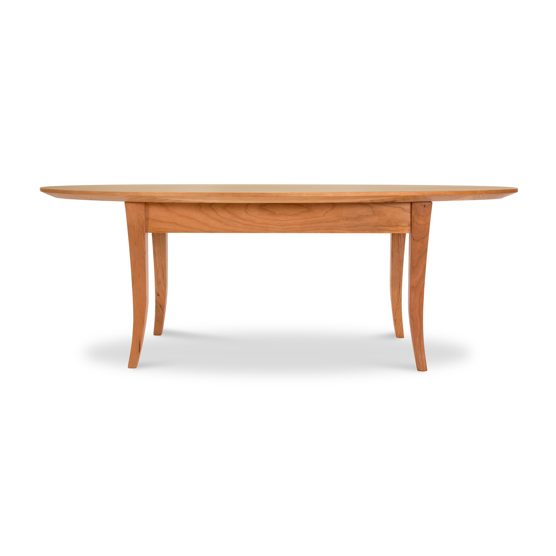 A Lyndon Furniture Classic Shaker Flare Leg Oval Top Coffee Table, made from sustainably harvested hardwoods in Vermont, featuring a classic shaker design with flared legs.