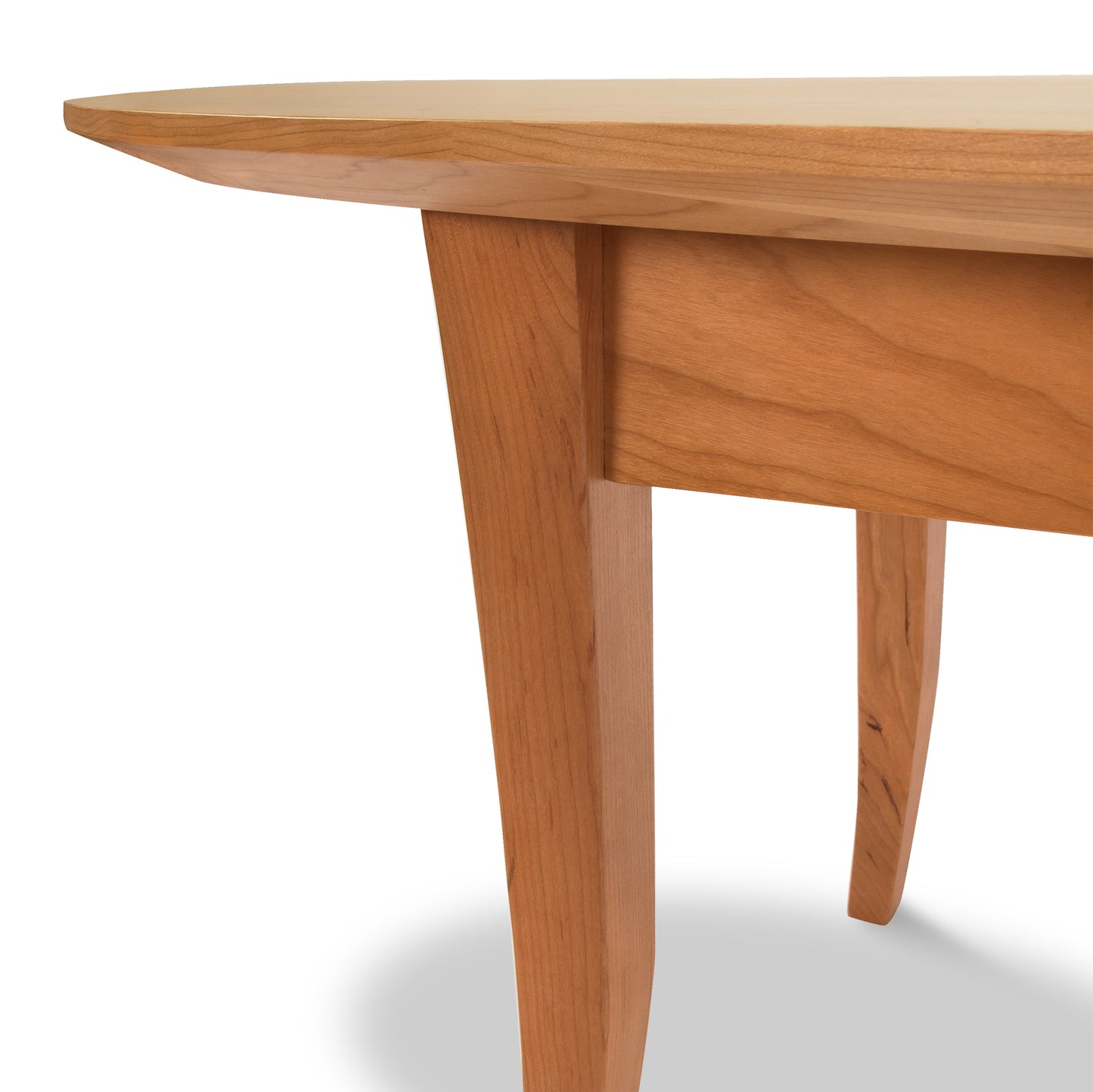 Lyndon Furniture Classic Shaker Flare Leg Oval Top Coffee Table crafted from sustainable hardwoods, featuring elegant curved legs and smooth wood grain.