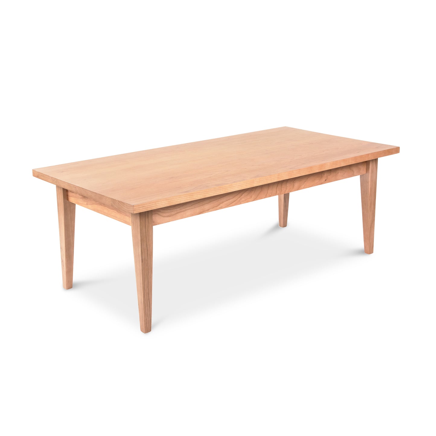 Classic Shaker Coffee Table by Lyndon Furniture with four tapered legs and a sleek rectangular wooden top, showcasing traditional craftsmanship.