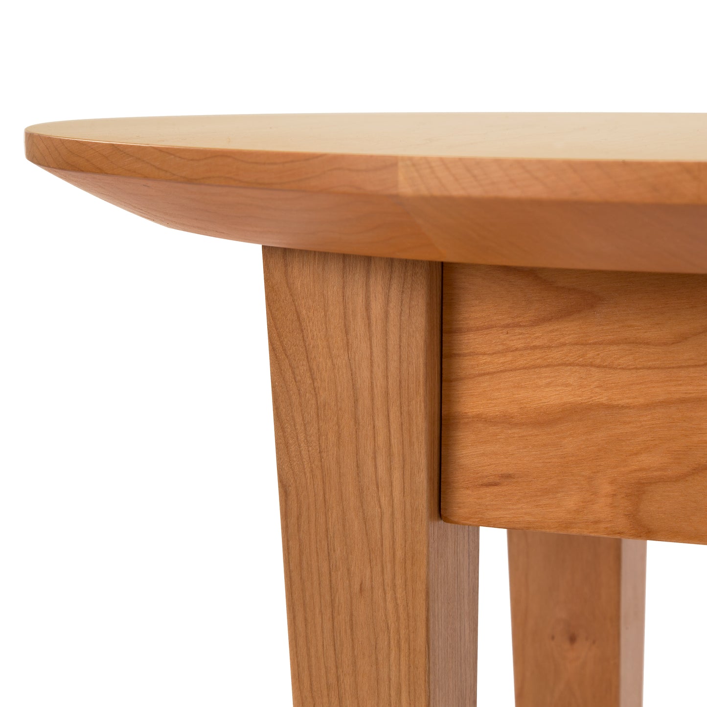 Classic Shaker Round Flare Leg End Table by Lyndon Furniture showcasing its smooth finish, elegant flare legs, and detailed natural wood grain.