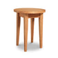 A simple Lyndon Furniture Classic Shaker Round End Table with four legs isolated on a white background.