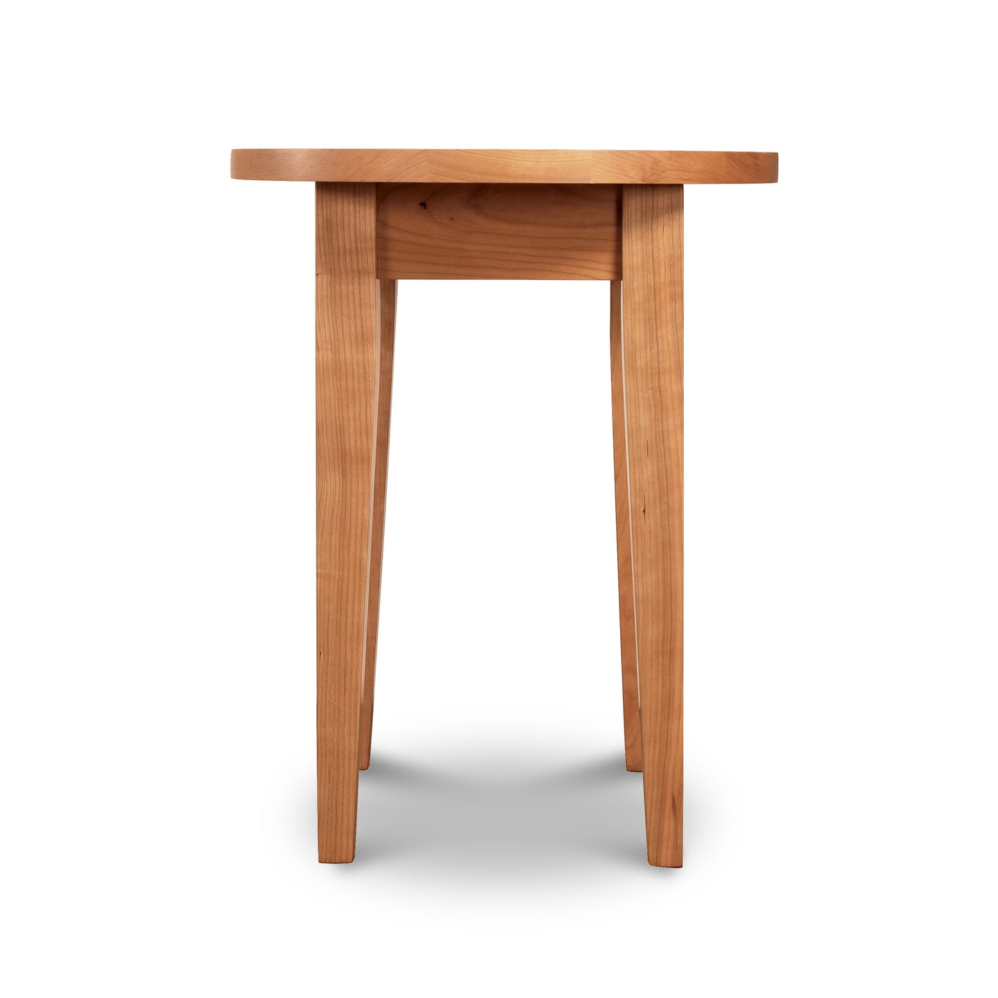 A Classic Shaker Round End Table from Lyndon Furniture with a simple design, crafted from sustainable wood, featuring four legs and a flat top, isolated on a white background.