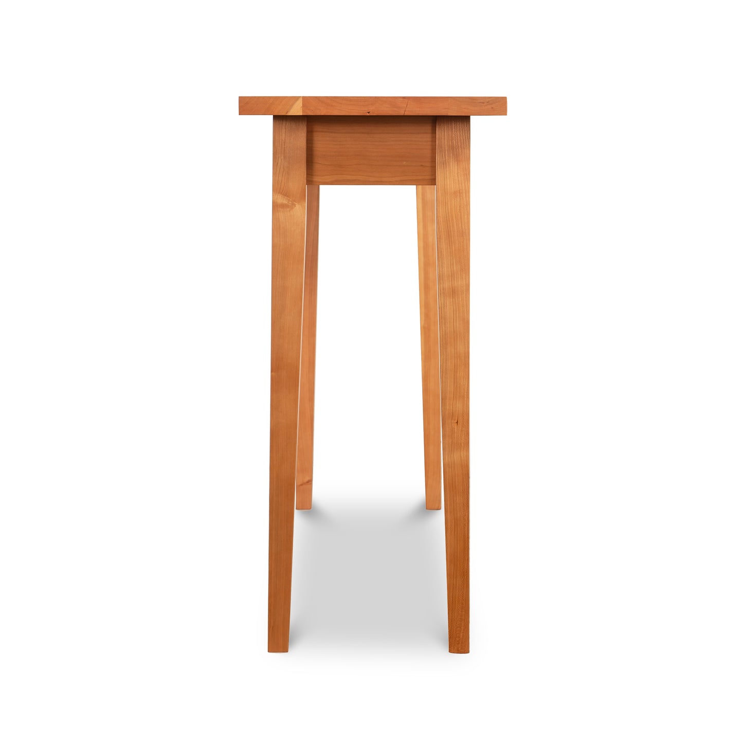 A small Classic Shaker Sofa Table - Floor Model with narrow wooden legs by Lyndon Furniture.