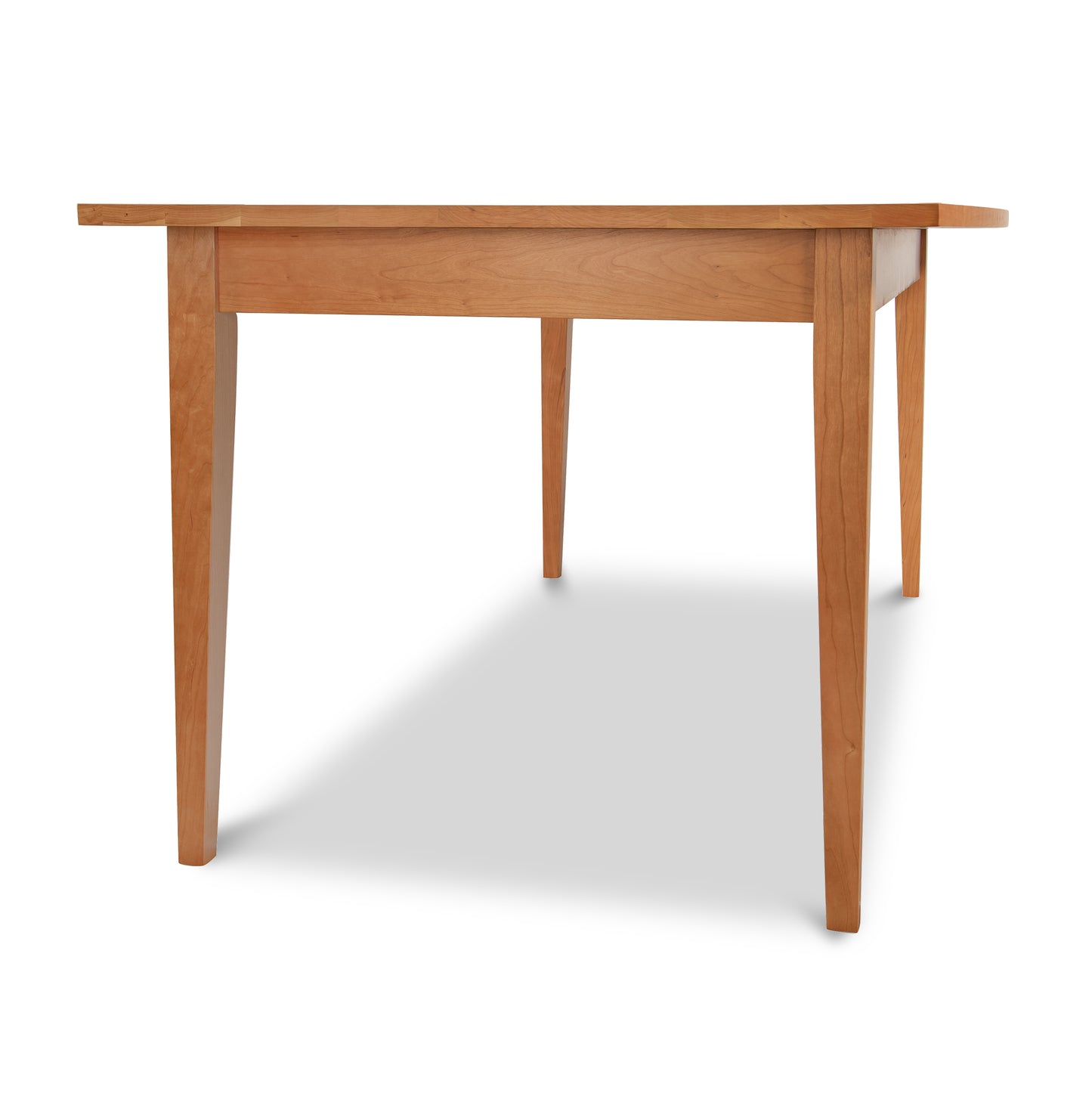 Lyndon Furniture Classic Shaker Boat Top Table made of natural hardwood with four legs, highlighting elegant craftsmanship and solid design.
