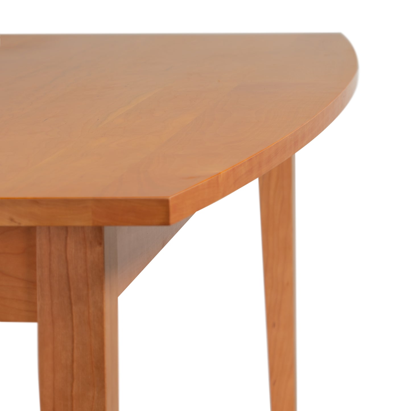 A Classic Shaker Solid Boat Top Table by Lyndon Furniture hardwood dining table with a curved top.