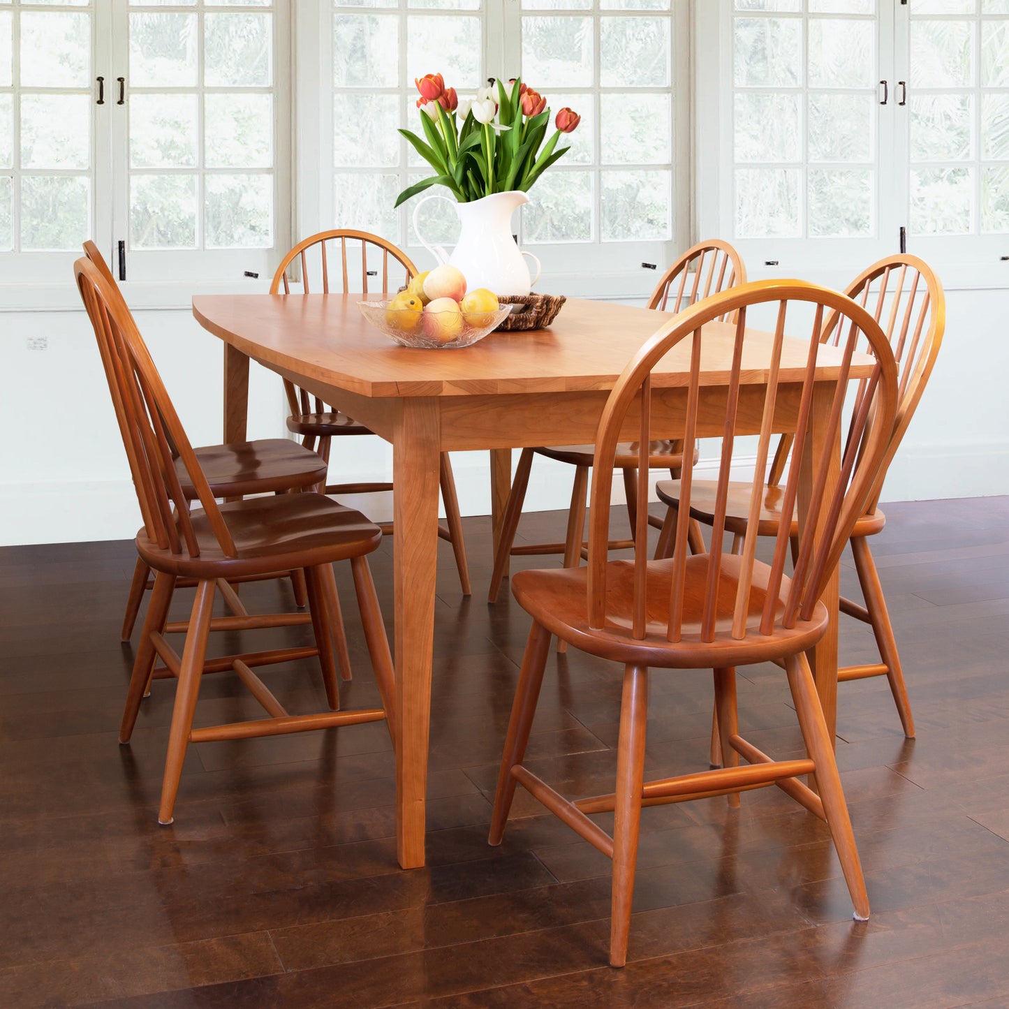 Lyndon Furniture Classic Shaker Solid Boat Top Table with six matching chairs, featuring tulip and fruit bowl centerpiece.