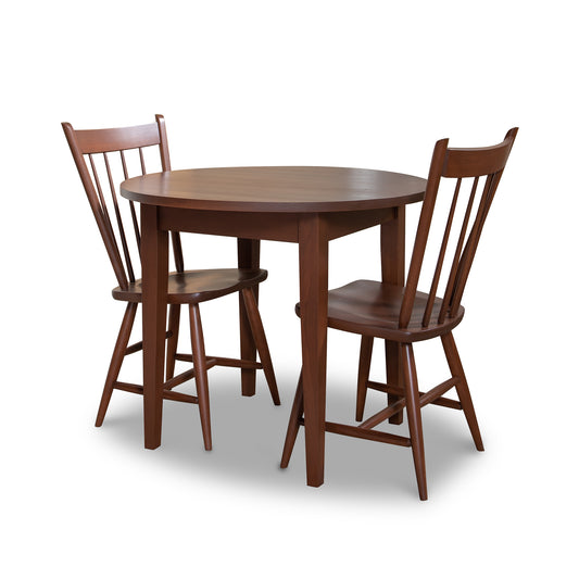 A round table and two chairs on a white background.