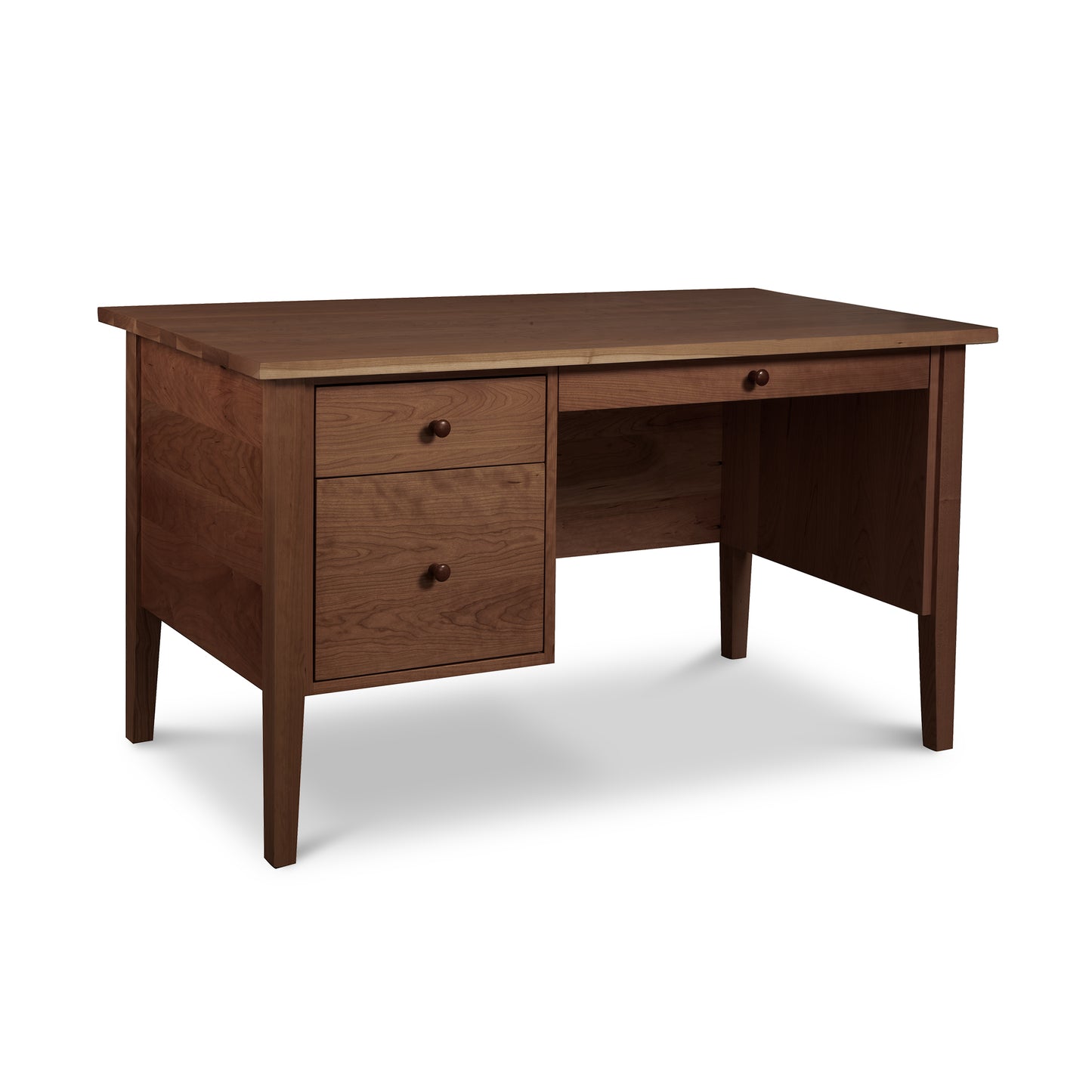 Lyndon Furniture Small Wood Executive Desk with three drawers on the left, open right seating area, and a smooth rectangular tabletop in solid wood.
