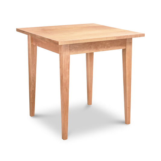 Lyndon Furniture Classic Shaker Square Dining Table with four straight legs and solid hardwood construction, showcasing timeless shaker design.