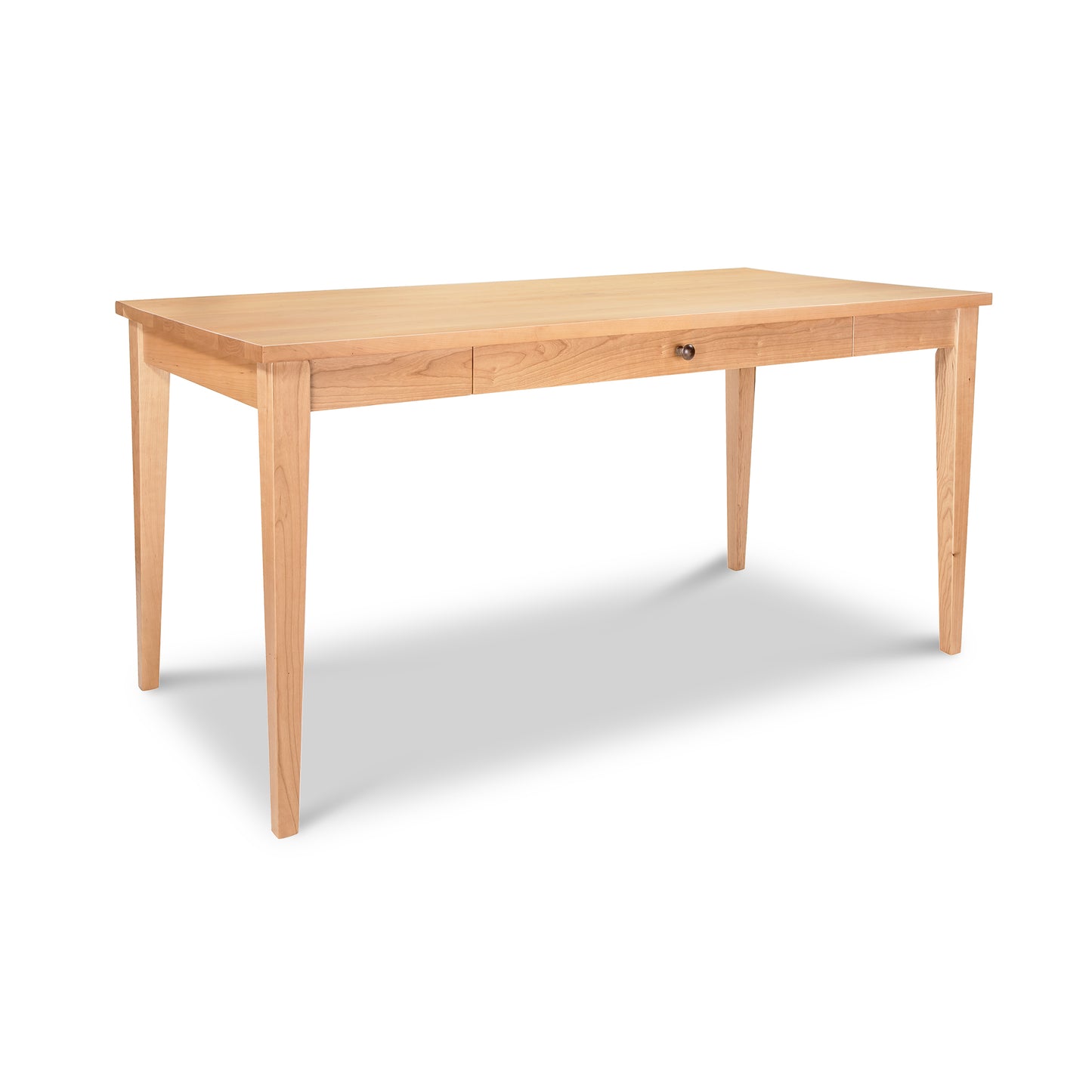 Lyndon Furniture Classic Shaker Writing Desk made of eco-friendly solid wood with four tapered legs and a central drawer, highlighting its timeless, handcrafted design.