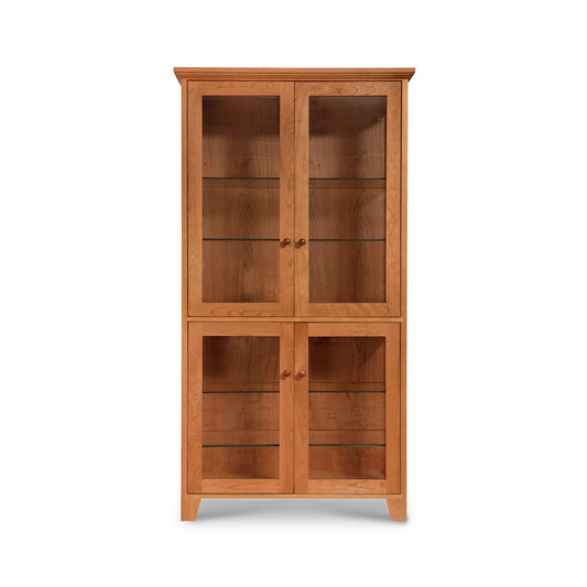 Lyndon Furniture Classic Vermont Curio Cabinet with four glass doors and shelves, expertly handcrafted from sustainable wood.