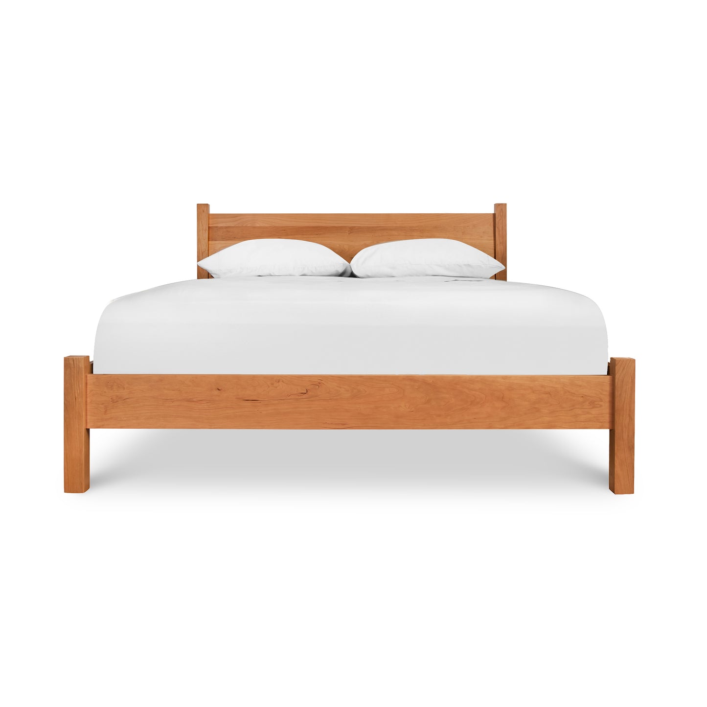 Classic Wood Bed by Lyndon Furniture showcasing a solid wood frame and high headboard with a white mattress and pillows.