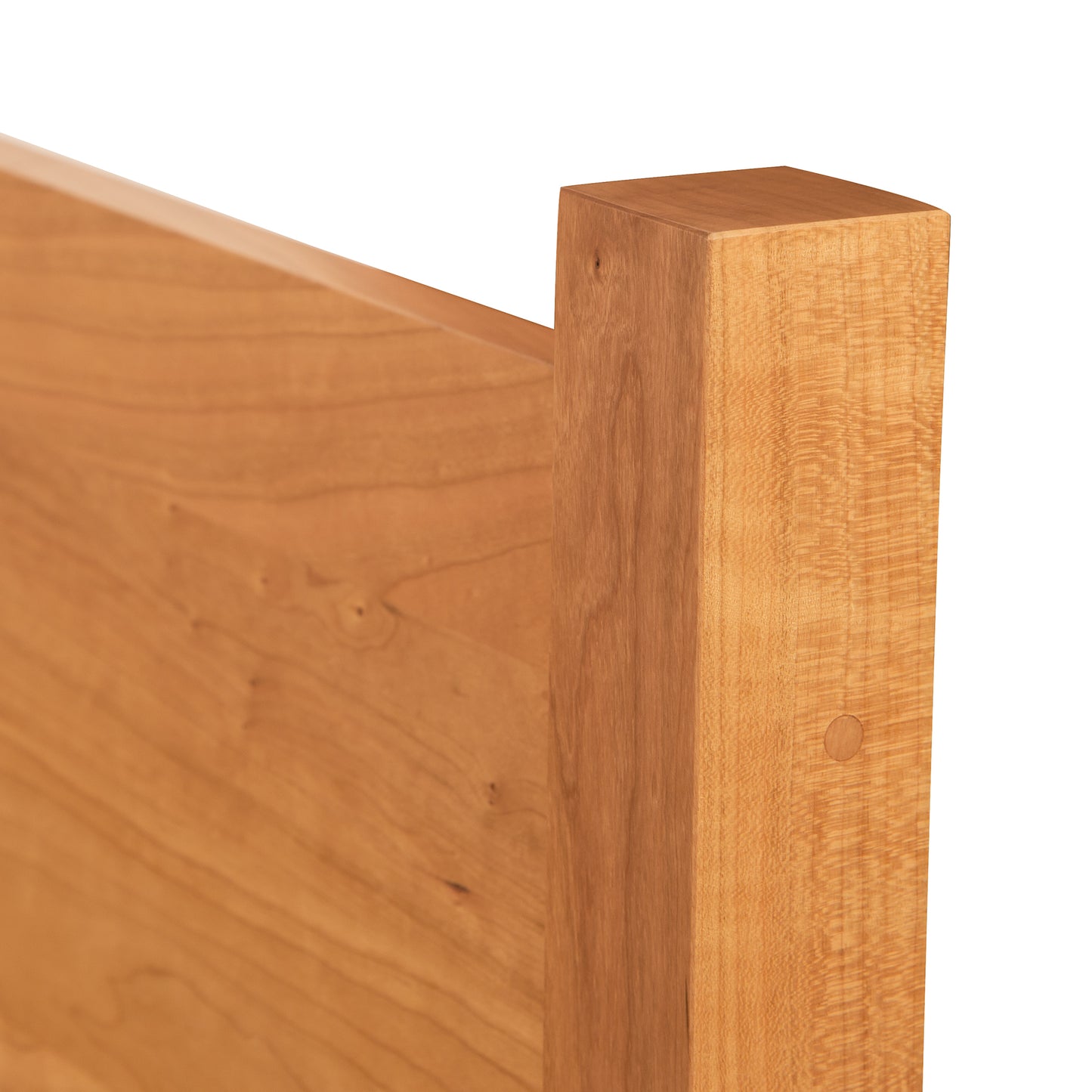 Classic Wood Bed corner by Lyndon Furniture highlighting smooth wood grain, clean lines, and a light brown finish.