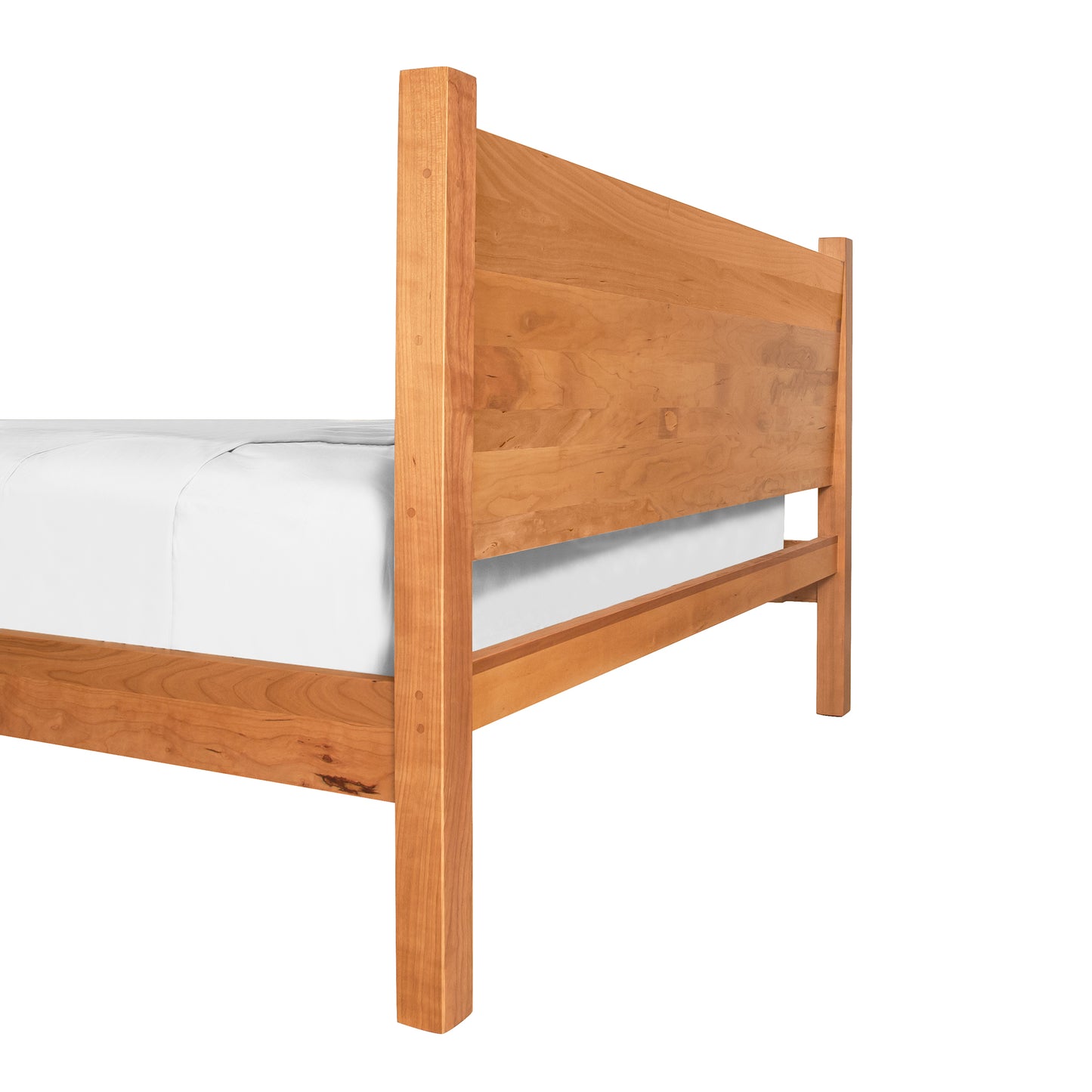 Classic Wood Bed made from sustainably harvested wood with a natural finish, includes white mattress.