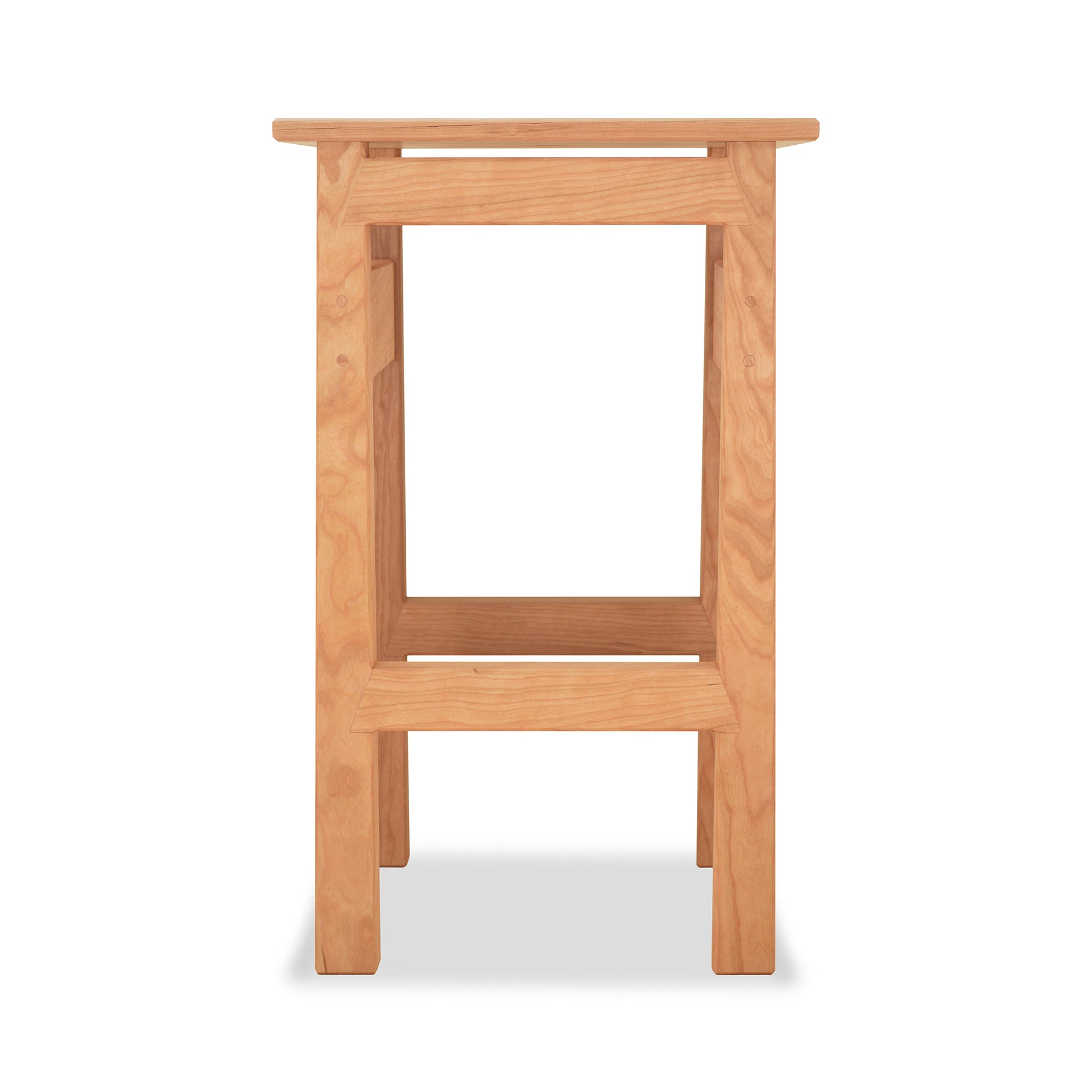 A Maple Corner Woodworks contemporary Asian stool, eco-friendly and made of natural wood with a single step, isolated against a white background.