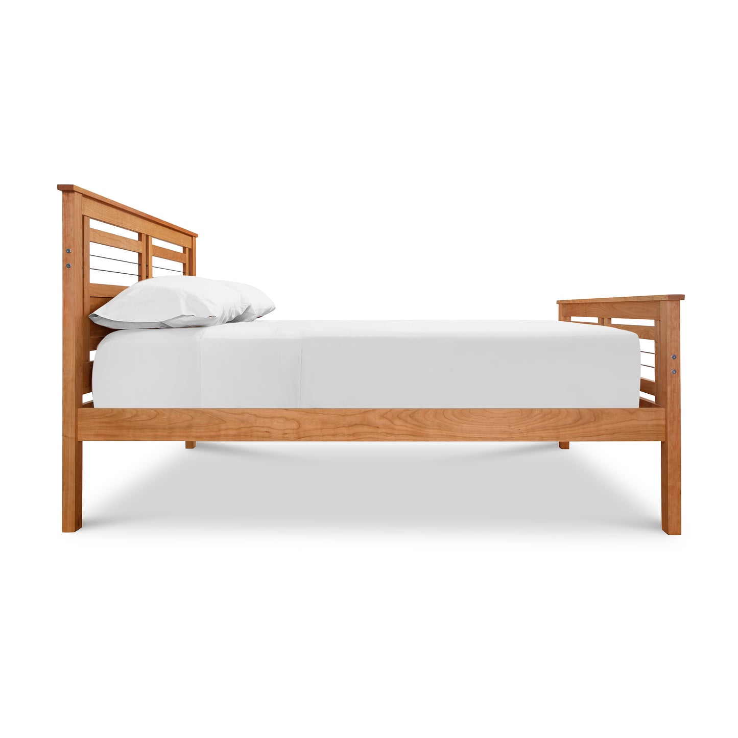 Contemporary Cable Bed frame by Vermont Furniture Designs with a white mattress and a single white pillow, isolated on a white background, featuring an eco-friendly hand-rubbed oil finish.