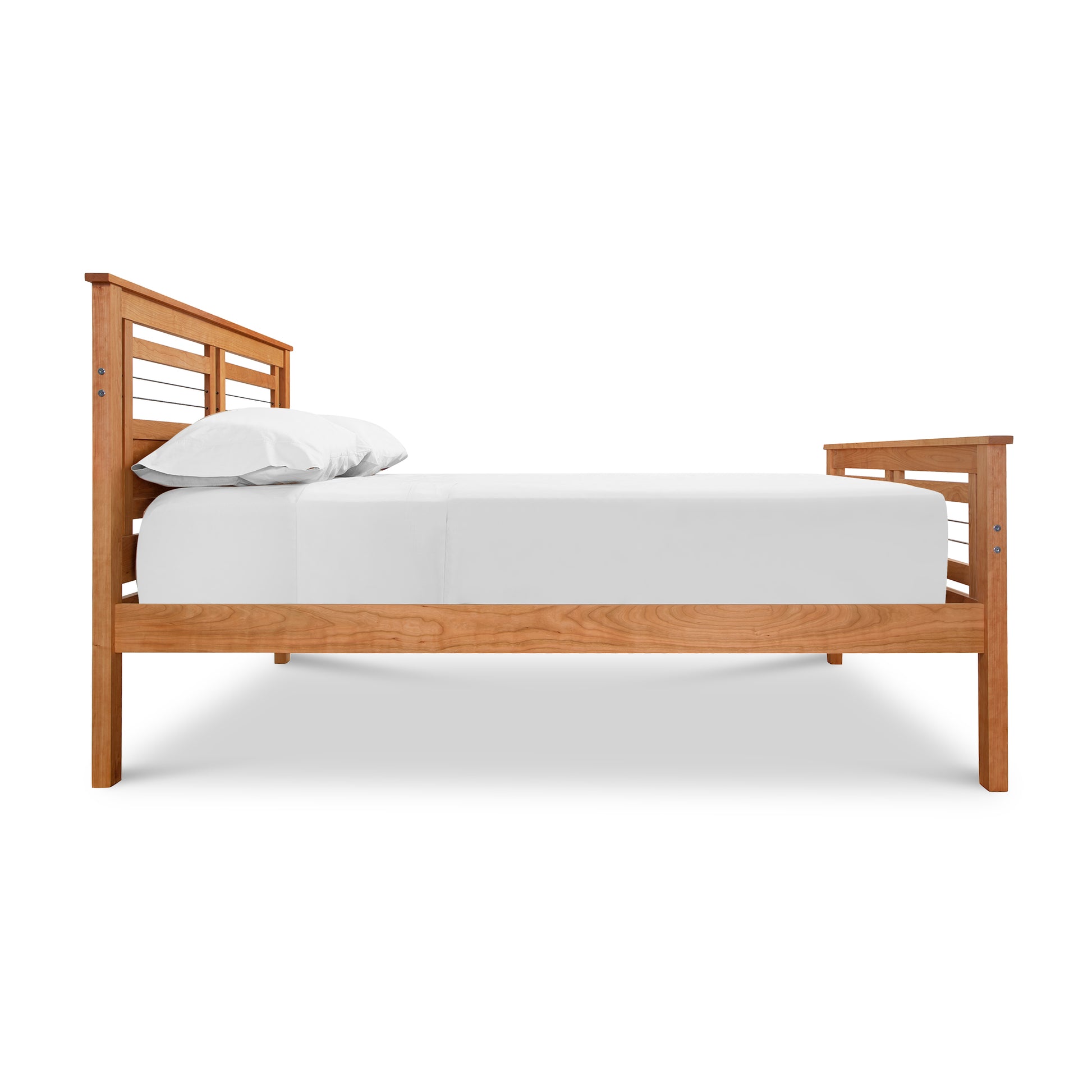 Contemporary Cable Bed by Vermont Furniture Designs, showcasing solid hardwood slats with a white mattress and pillows.
