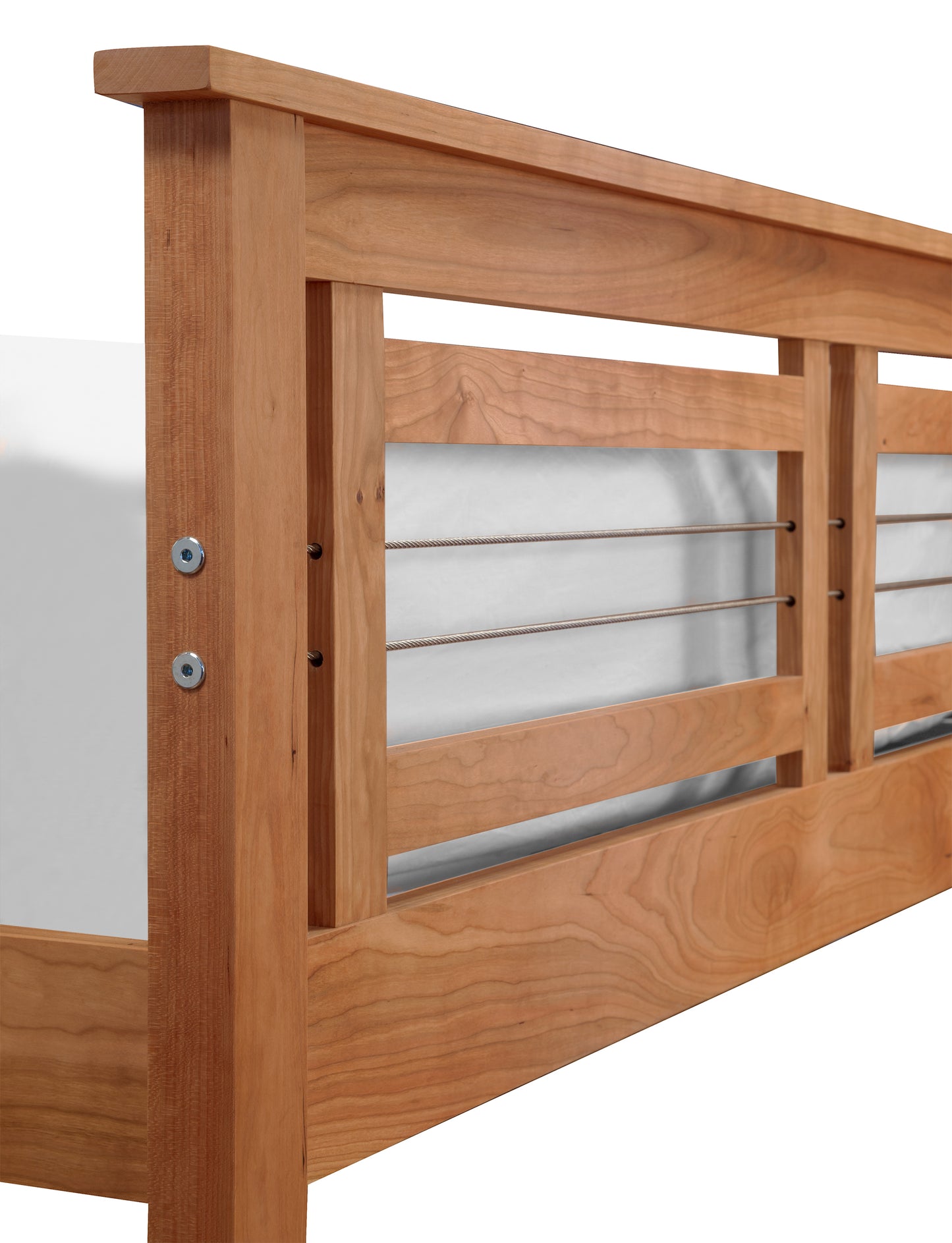Partial view of a Vermont Furniture Designs Contemporary Cable Bed with a headboard featuring horizontal slats, showing one side perpendicular to a white background. Visible hardware includes several screws and bolts for assembly.