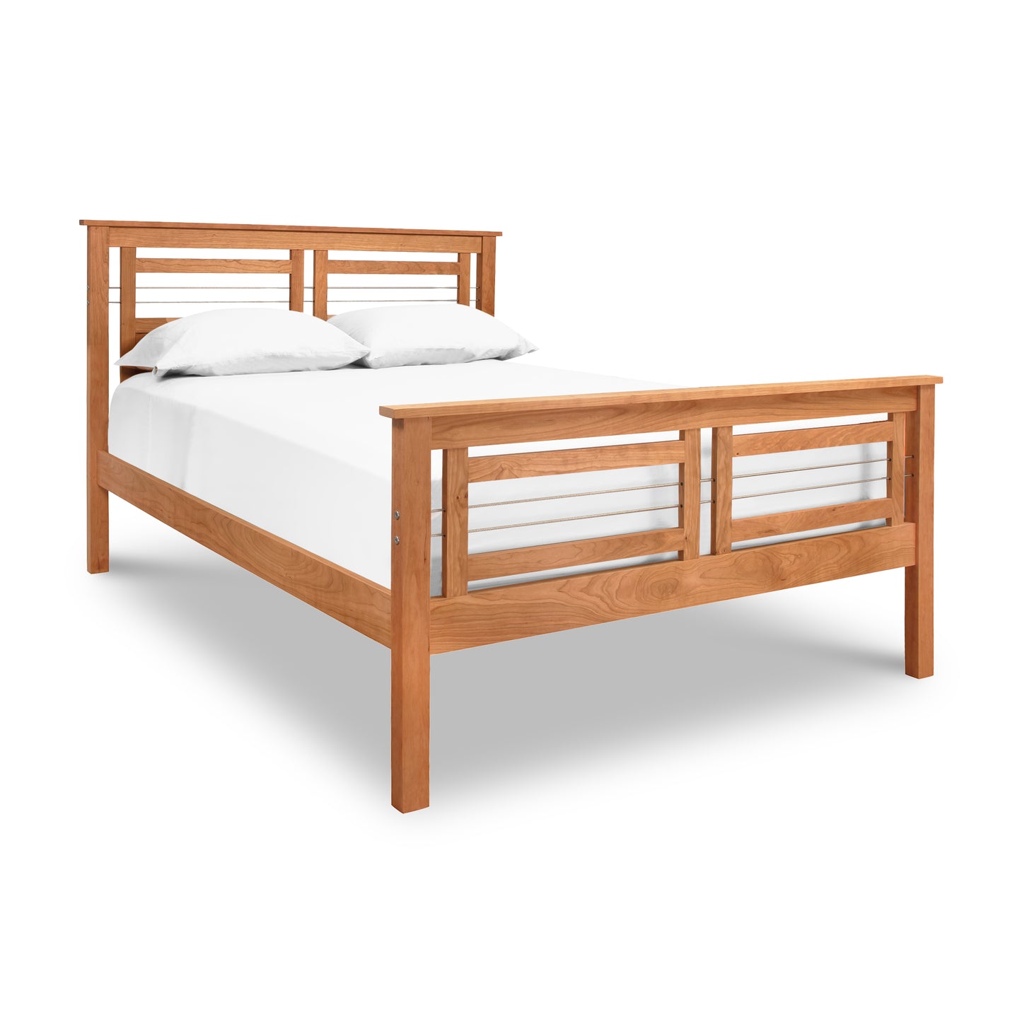 A Contemporary Cable Bed frame by Vermont Furniture Designs with a solid hardwood construction, featuring a white mattress and two pillows against a white background.