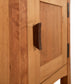 A close-up view of a Vermont Furniture Designs Contemporary Craftsman 1-Drawer Nightstand with Door, featuring an eco-friendly oil finish, set against a neutral background.