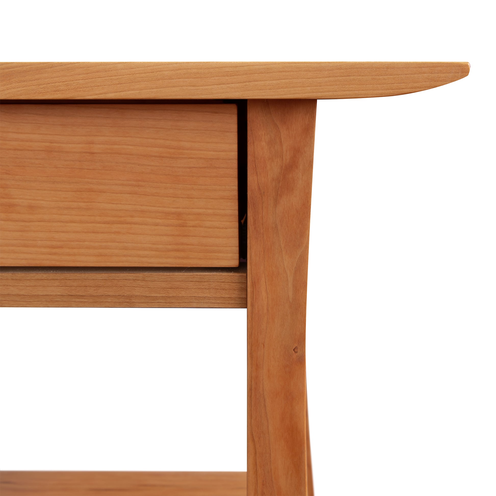 Close-up of a Vermont Furniture Designs Contemporary Craftsman Console Coffee Table corner showing detail of the grain and joinery, featuring solid hardwoods with an eco-friendly oil finish.