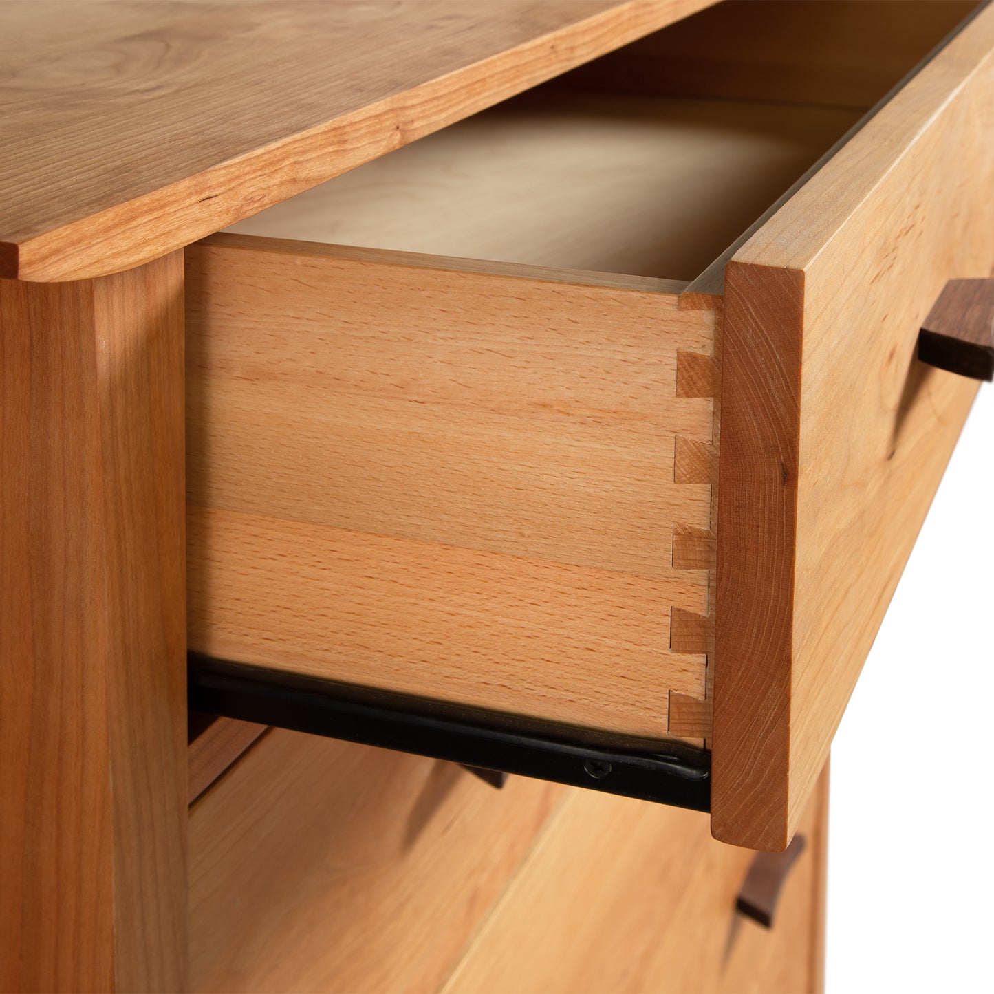 Vermont Furniture Designs Contemporary Craftsman 5-Drawer Chest featuring dovetail joints and an eco-friendly oil finish, highlighting fine craftsmanship and wood grain details.