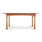 A Contemporary Craftsman Extension Dining Table with a simple design, featuring four legs and a smooth top, crafted by Vermont Furniture Designs woodworkers and isolated on a white background.