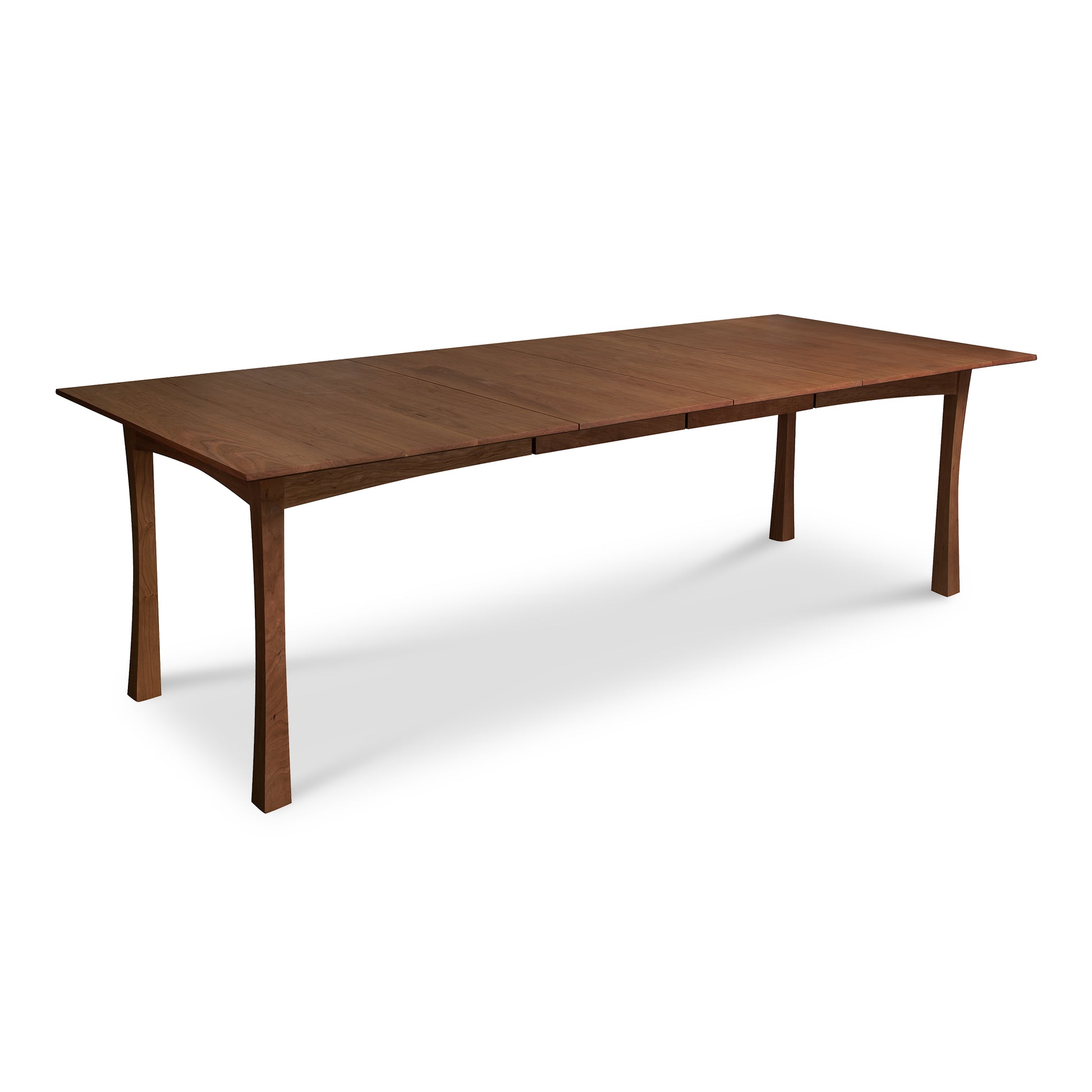 Contemporary Craftsman Extension Dining Table with a smooth wood surface, straight edges, and elegantly curved legs handcrafted by Vermont Furniture Designs.