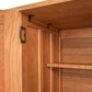 Interior view of a Contemporary Craftsman Huntboard cabinet from Vermont Furniture Designs showing the door hinge and a shelf, designed with an Arts & Crafts aesthetic.