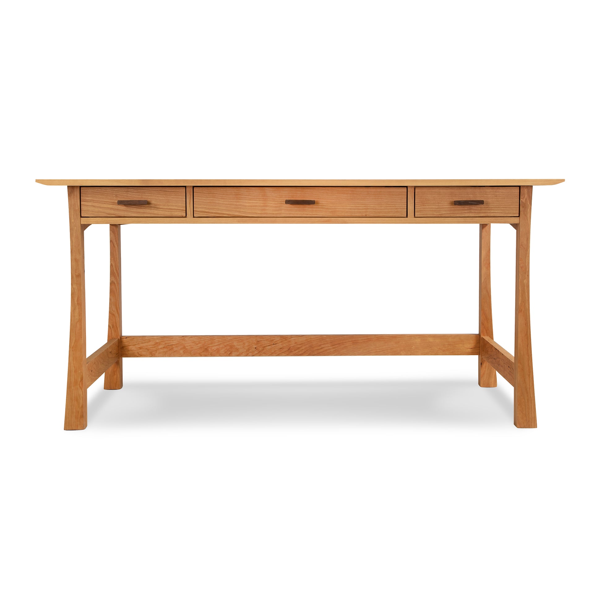 A solid Cherry Contemporary Craftsman Library Desk by Vermont Furniture Designs, featuring a clear finish, with three drawers and tapered legs, isolated on a white background.
