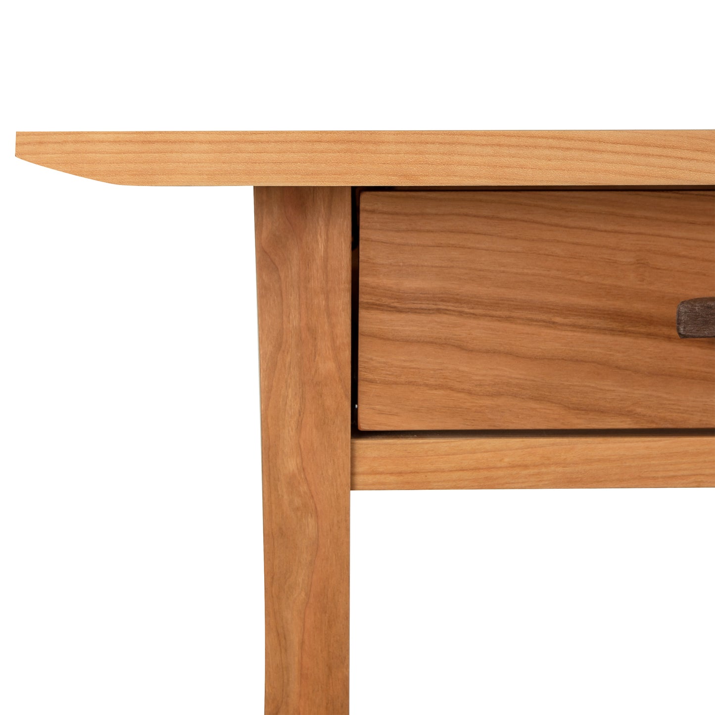 Close-up of a Vermont Furniture Designs Contemporary Craftsman Library Desk corner with a single drawer, showcasing the wood grain and carpentry details.