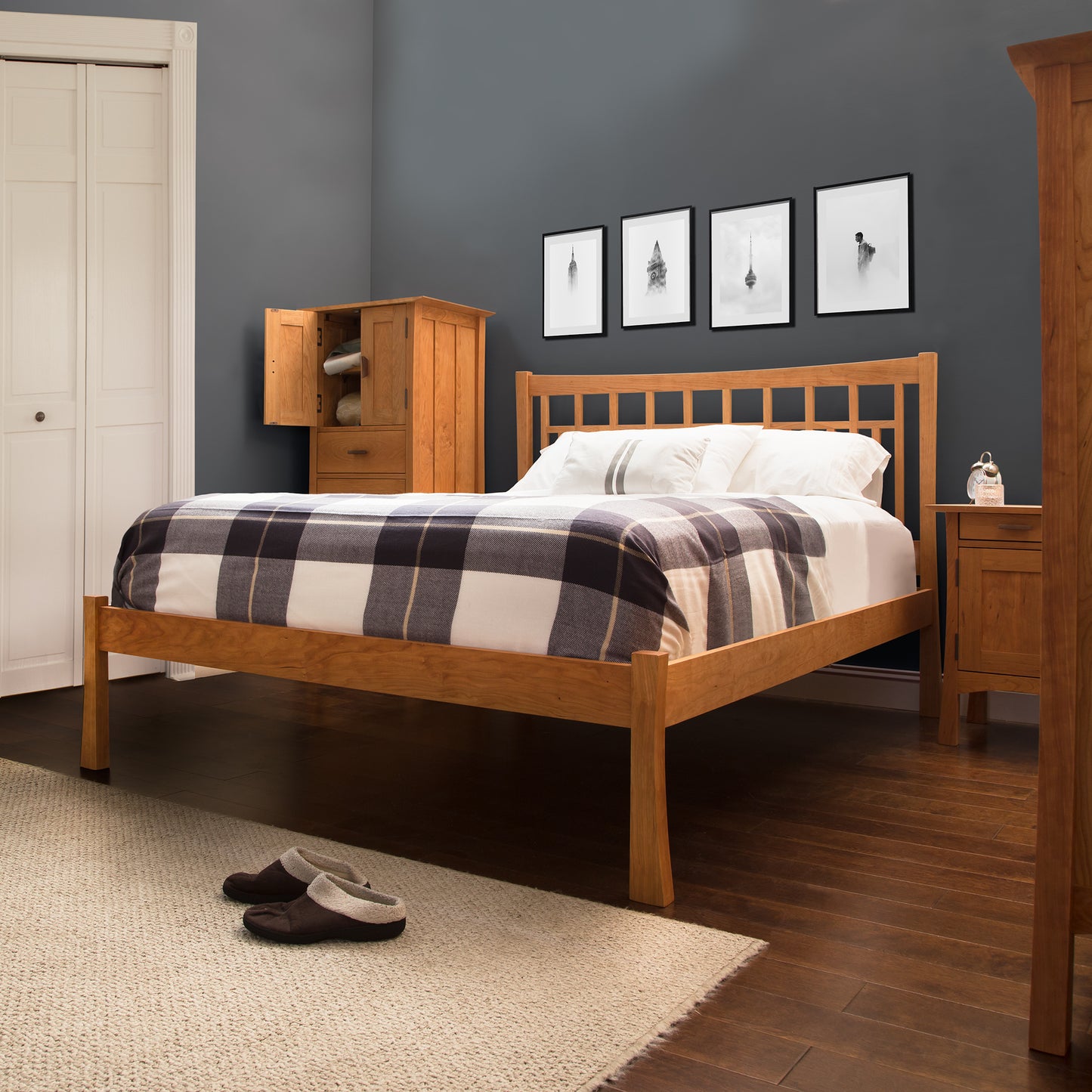 Vermont Furniture Designs bed with plaid bedding and bedside cabinet.