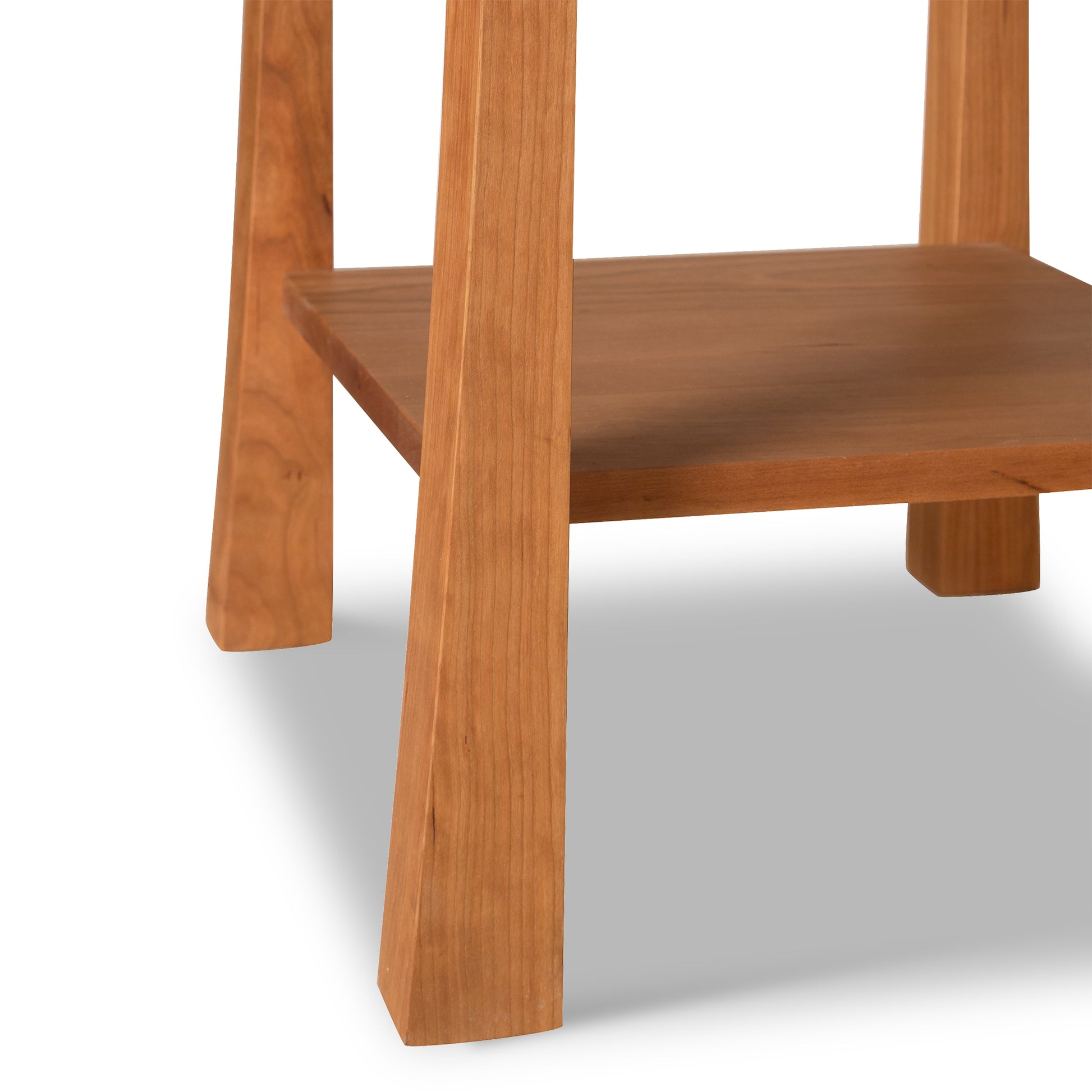 Contemporary Craftsman Nightstand with eco-friendly finish, square legs, and functional open shelf by Vermont Furniture Designs.