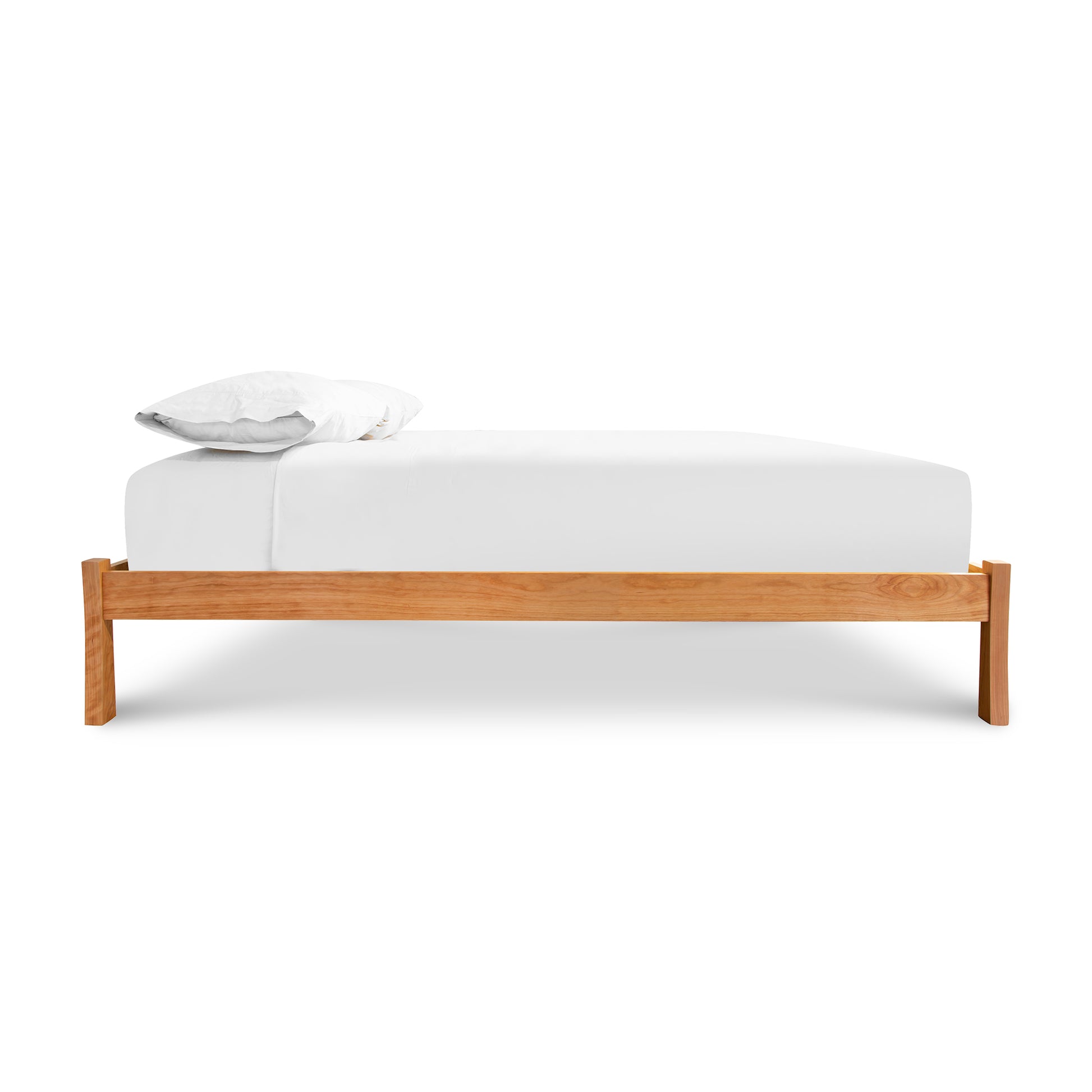 Contemporary Craftsman Platform Bed crafted from sustainable hardwood by Vermont Furniture Designs, showcasing its elegant simplicity with a white mattress and pillow.