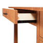 Open the Vermont Furniture Designs Contemporary Craftsman Study Desk drawer showing its slide mechanism and joinery against a white background, finished with an eco-friendly coating.