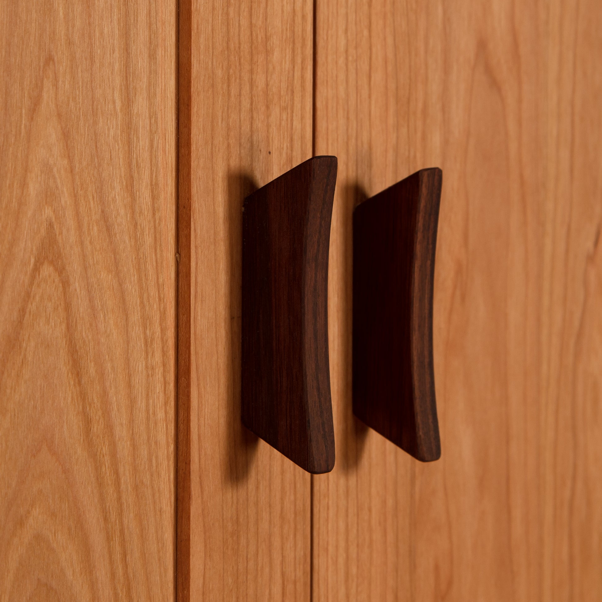 Contemporary Craftsman Tall Armoire by Vermont Furniture Designs, featuring sleek handles on light wood doors.