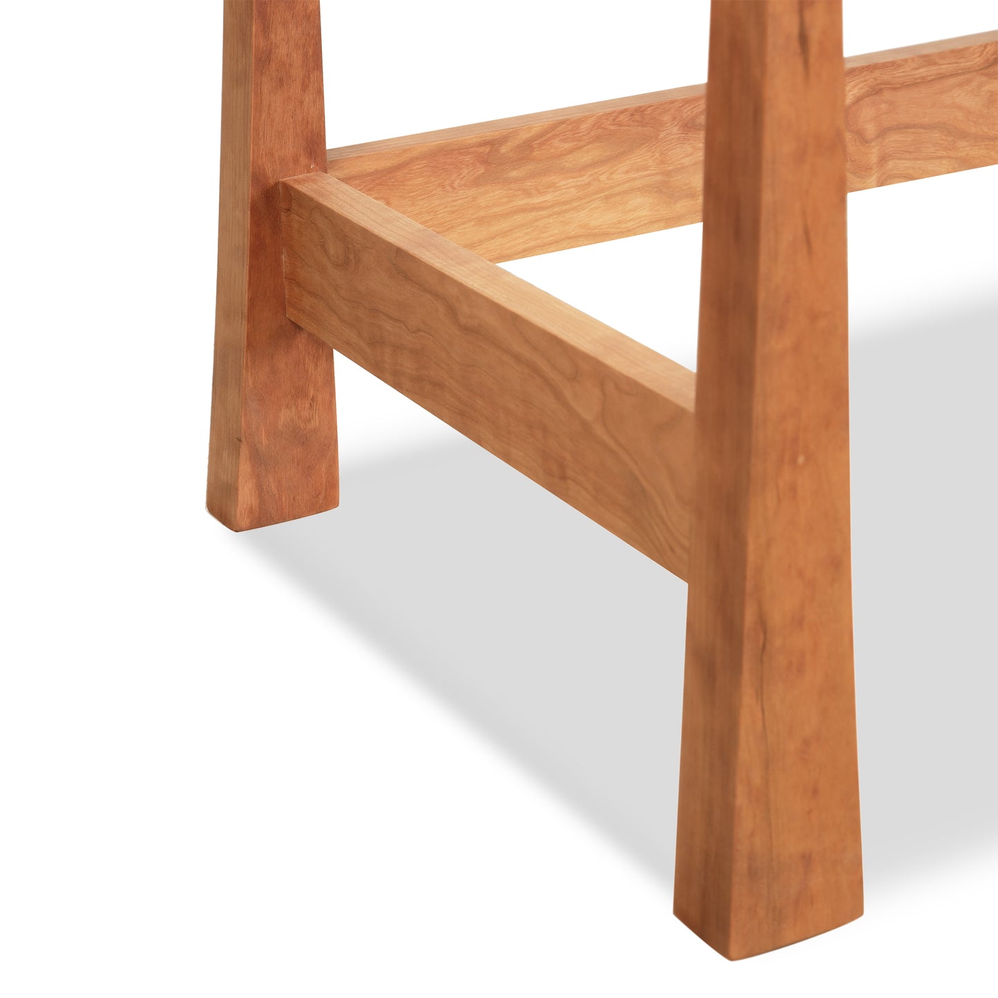 Detail of solid hardwood legs and support beam on Vermont Furniture Designs Contemporary Craftsman Writing Desk, showcasing quality craftsmanship.
