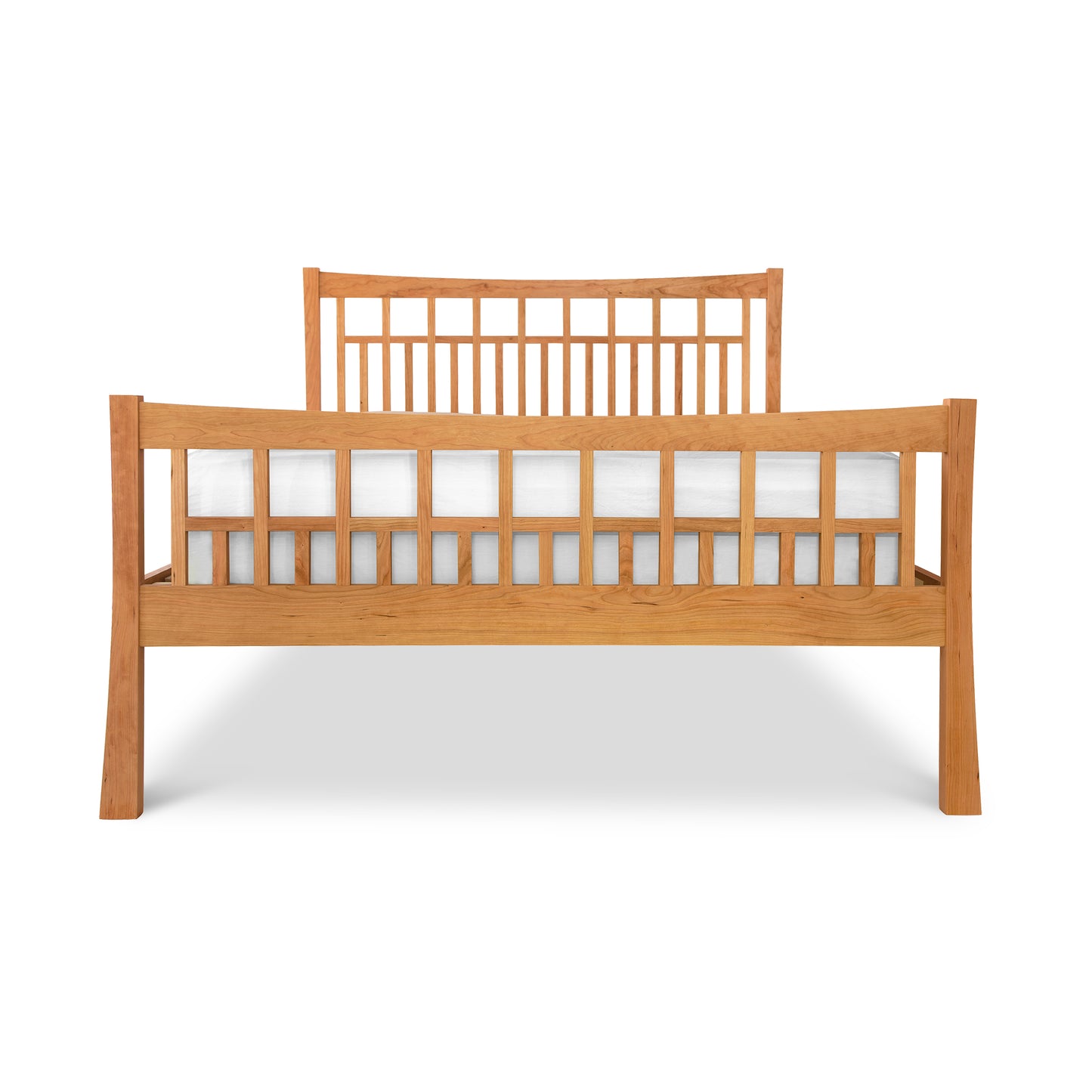 A Vermont Furniture Designs Contemporary Craftsman High Footboard Bed, solid wood bed frame with a slatted headboard and footboard, finished with eco-friendly oil, isolated on a white background.