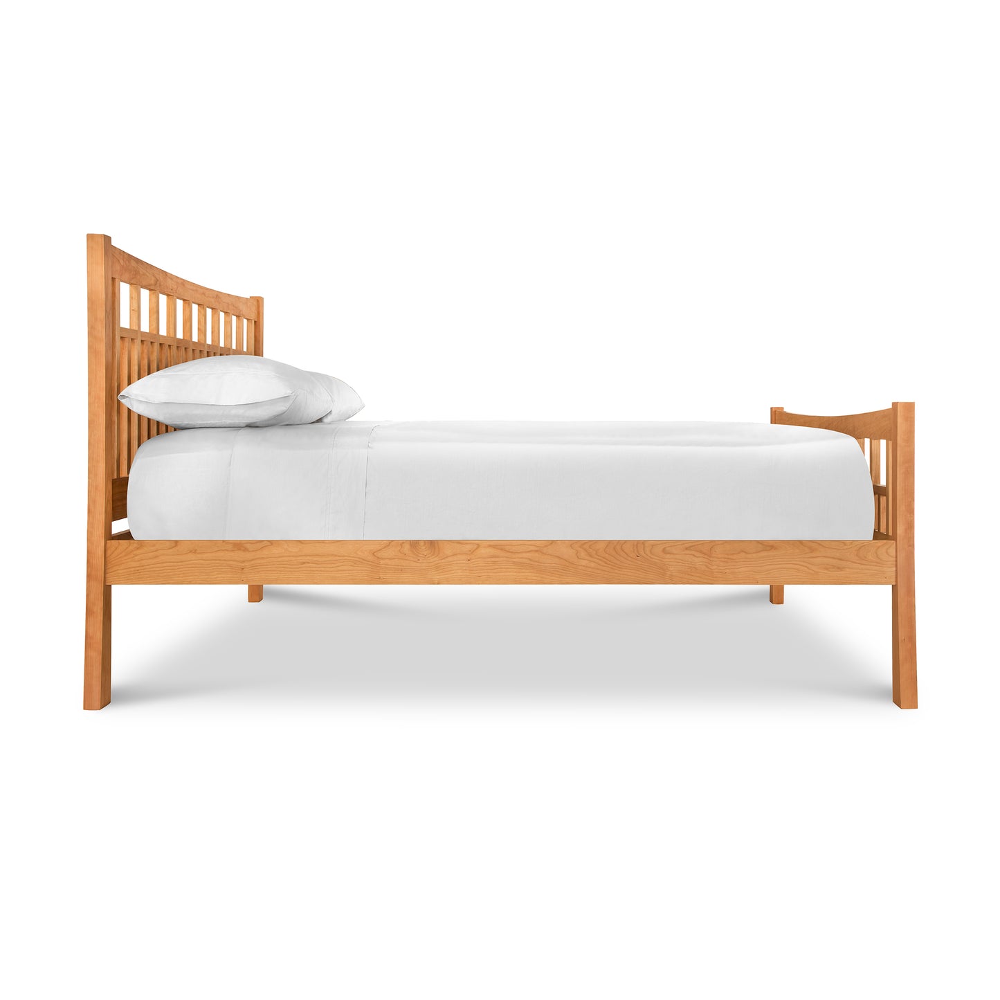 A Vermont Furniture Designs Contemporary Craftsman High Footboard Bed with white bedding and a pillow against a white background, featuring an eco-friendly oil finish.