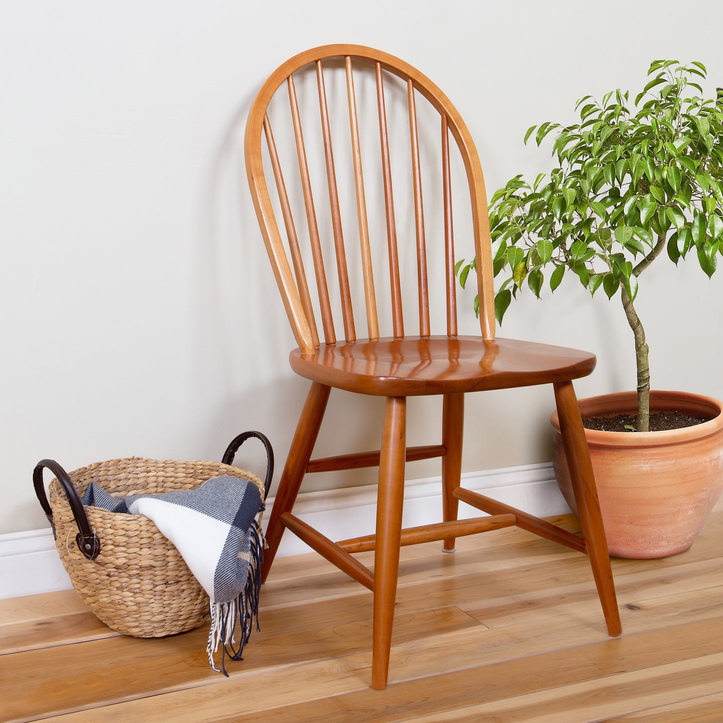 Contemporary Windsor Side Chair by Lyndon Furniture, expertly crafted from quality wood, displayed on a light wood floor against a plain wall.