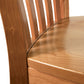 A close up of the back of a Vermont Woods Studios Country Shaker Side Chair with Scooped Wooden Seat - Ready to Ship.