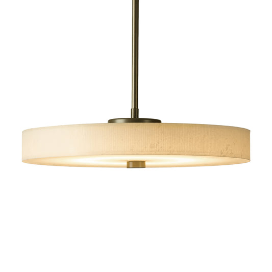 A Hubbardton Forge Disq Pendant light fixture with a round shade on a white background.