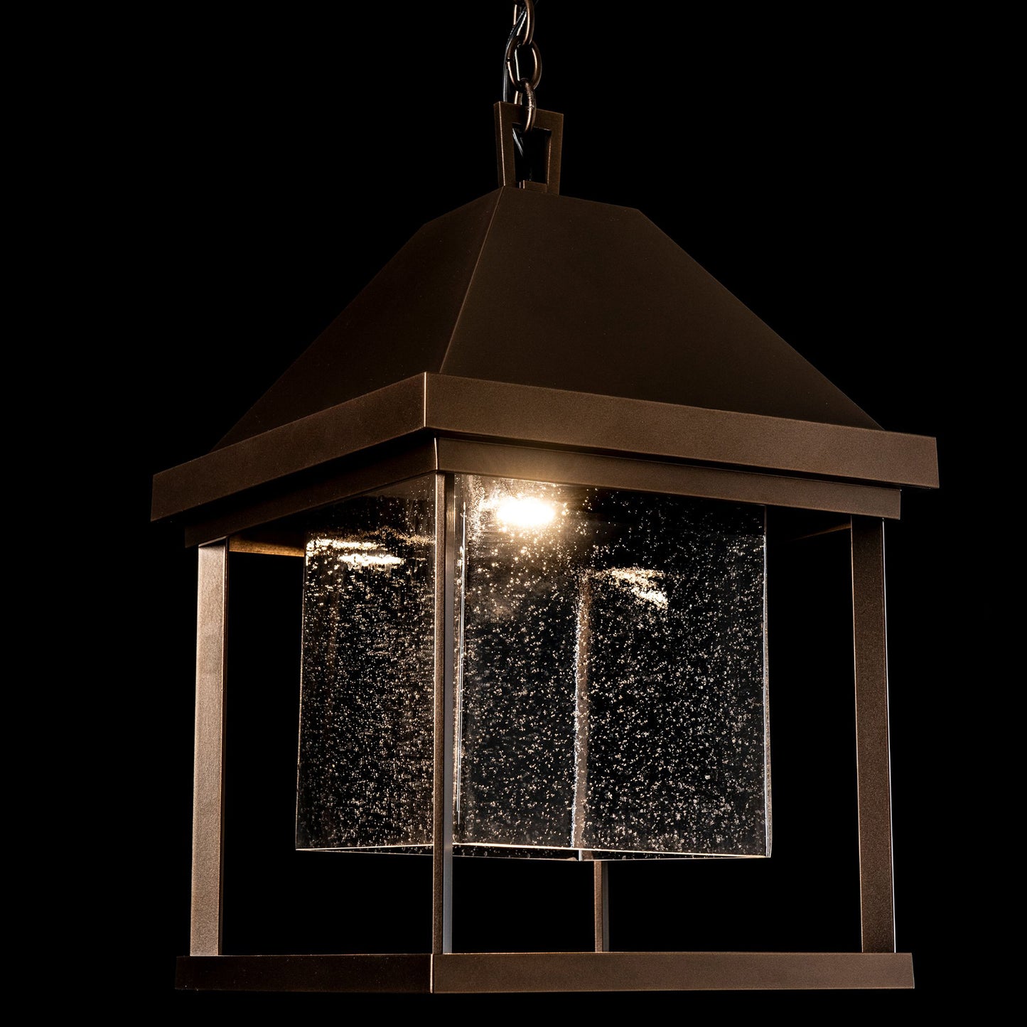 Hubbardton Forge Dorset Dark Sky Friendly Outdoor Lantern with a pyramid top and glass panels, highlighting its elegant design and craftsmanship.